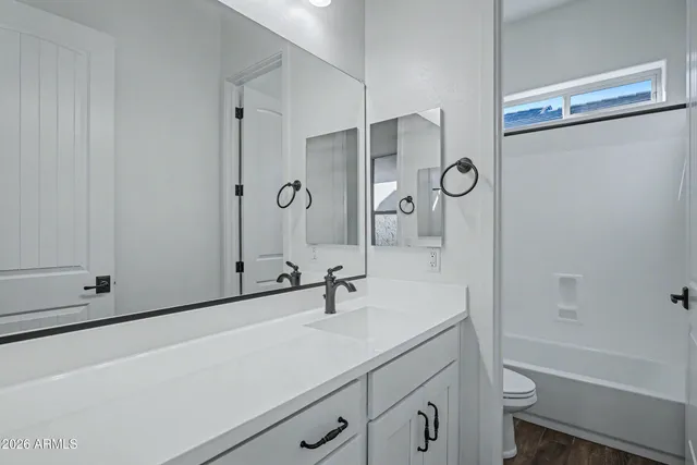 a bathroom with a shower and a toilet