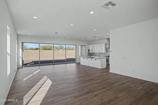 a kitchen with stainless steel appliances granite countertop a sink and cabinets