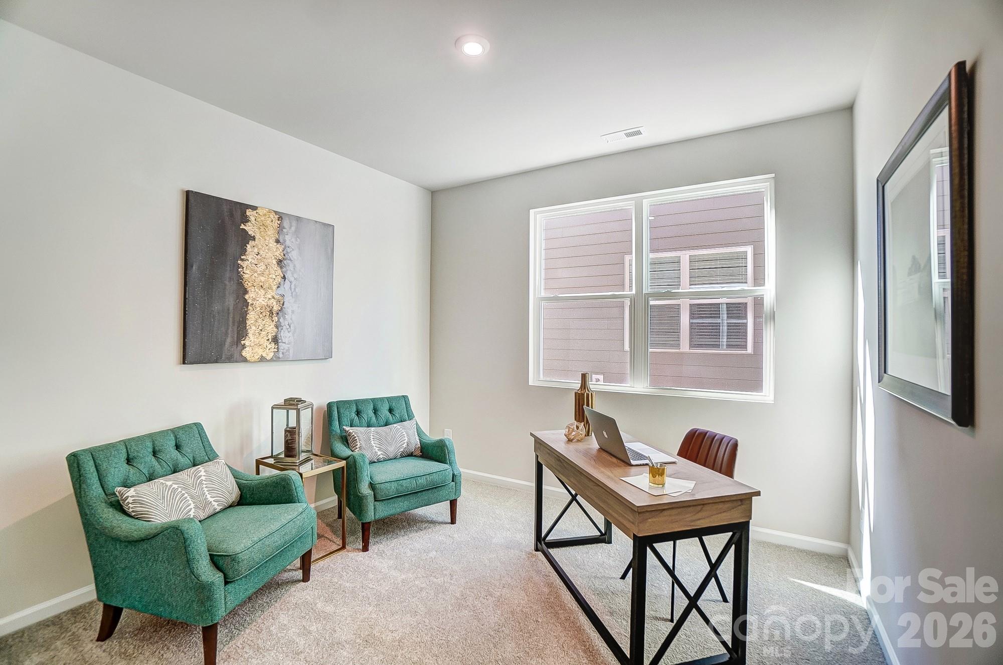 1456 McCollum Street Monroe, NC 28112 - Photo 22 of 29 a living room with furniture and a window