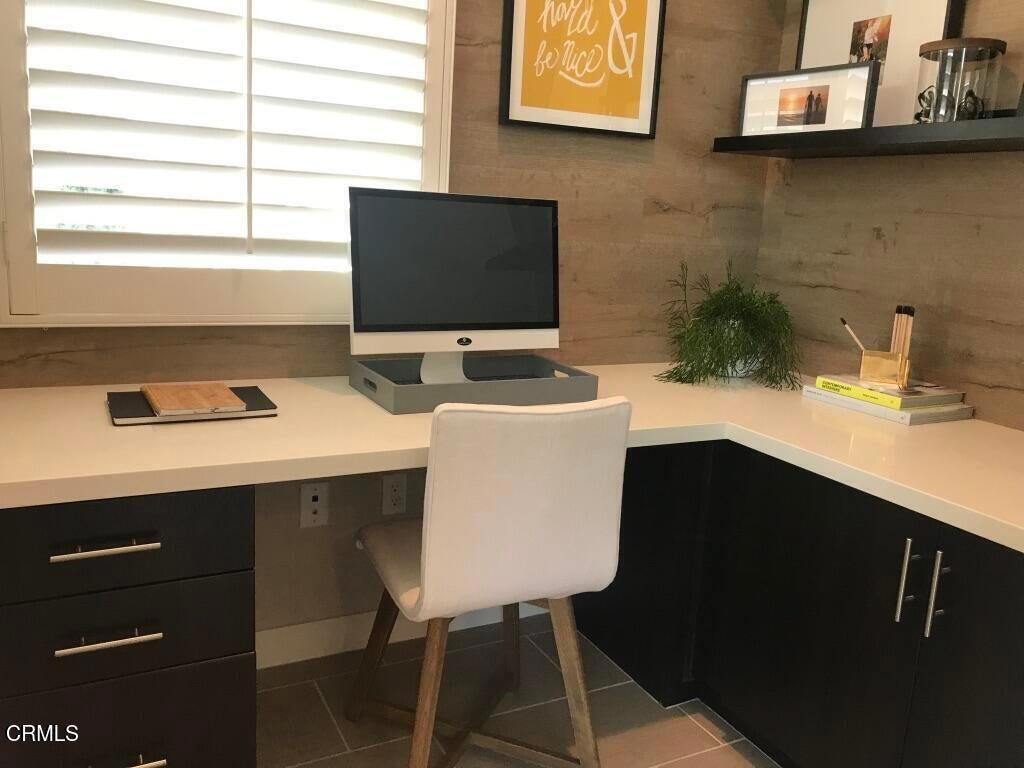 5663 Surfrider Way, Unit 101 Goleta, CA 93117 - Photo 11 of 54 a bathroom with a sink and a mirror
