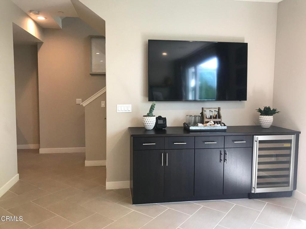 5663 Surfrider Way, Unit 101 Goleta, CA 93117 - Photo 5 of 54 a bathroom with a sink vanity and a mirror