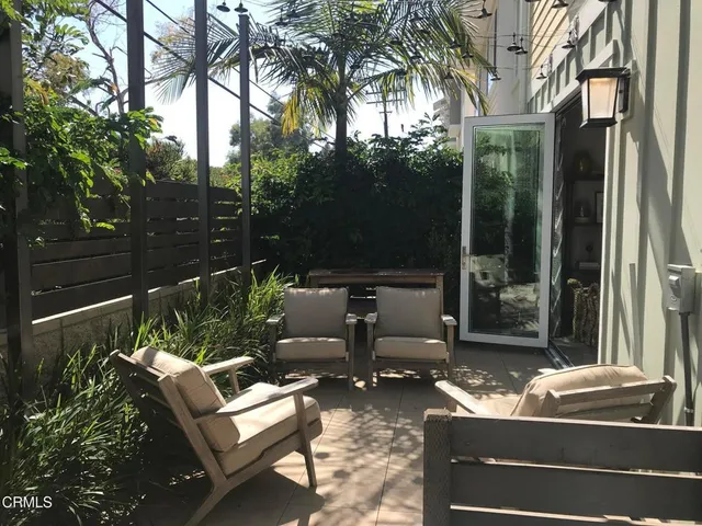 a outdoor living space with patio furniture and a potted plant