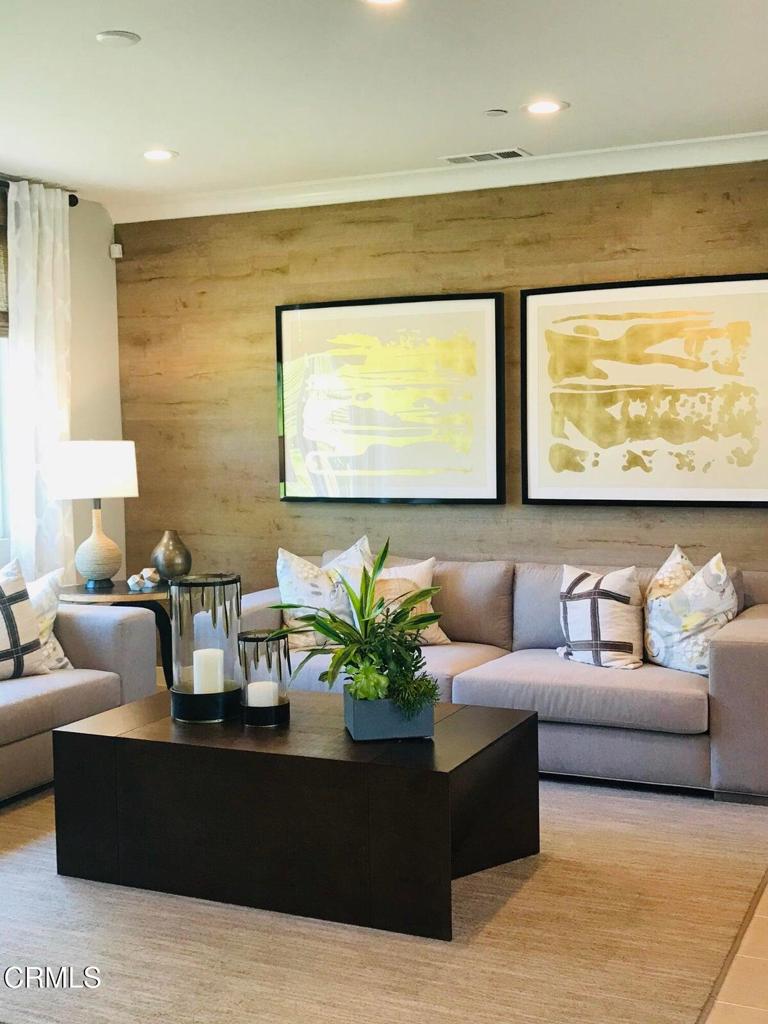 5663 Surfrider Way, Unit 101 Goleta, CA 93117 - Photo 10 of 54 a living room with furniture potted plant and a large window