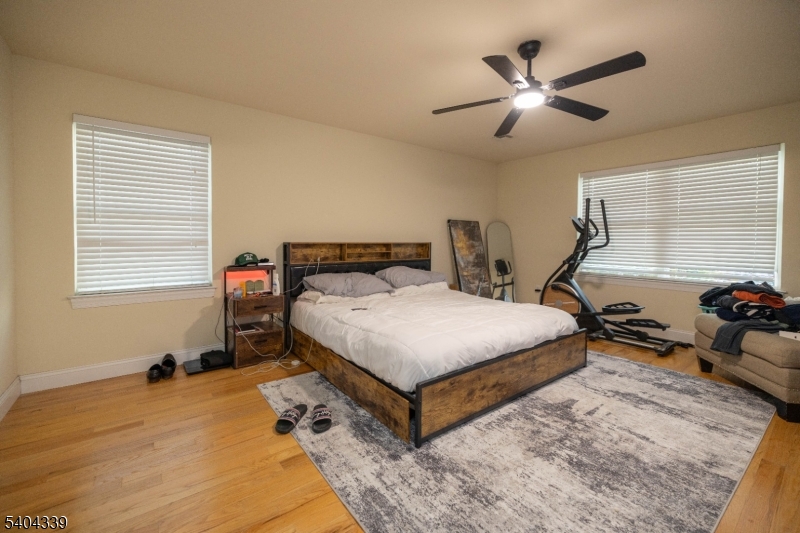 307 Pearl Street Elizabeth, NJ 07202 - Photo 8 of 13 a bedroom with a bed and window