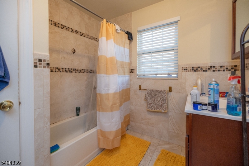 307 Pearl Street Elizabeth, NJ 07202 - Photo 9 of 13 a bathroom with a bathtub and shower