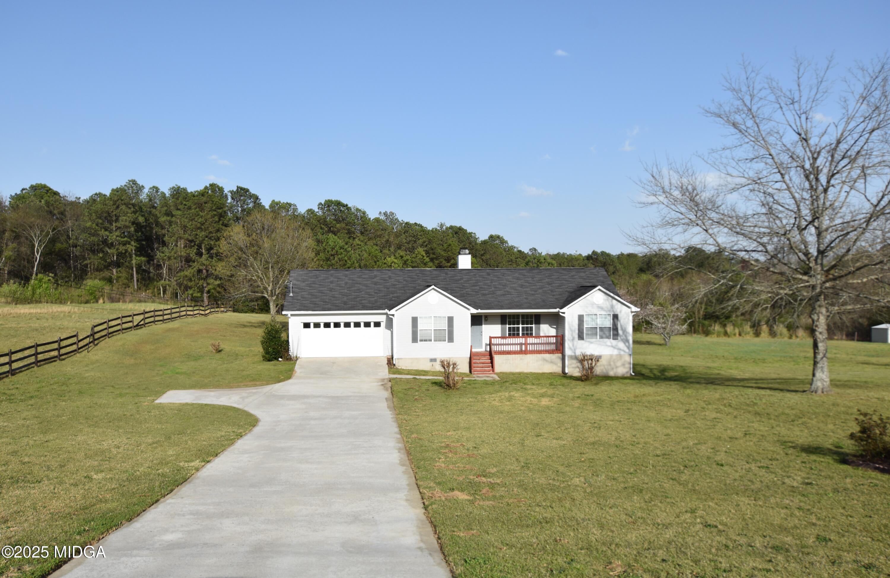 6550 Skipper Road Macon, GA 31216 - Photo 1 of 35 a front view of a house with a yard