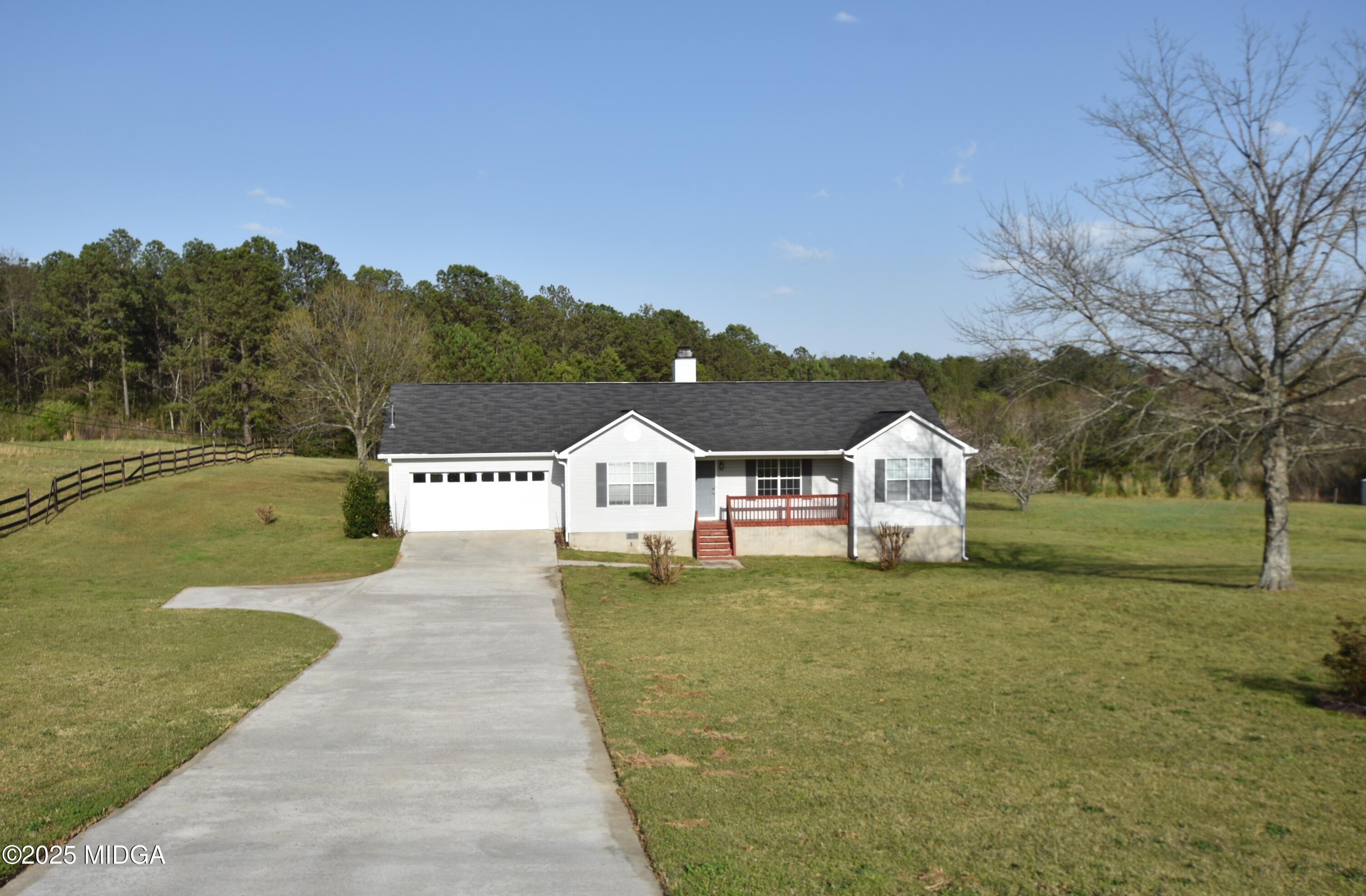 6550 Skipper Road Macon, GA 31216 - Photo 2 of 35 a view of a house with a yard