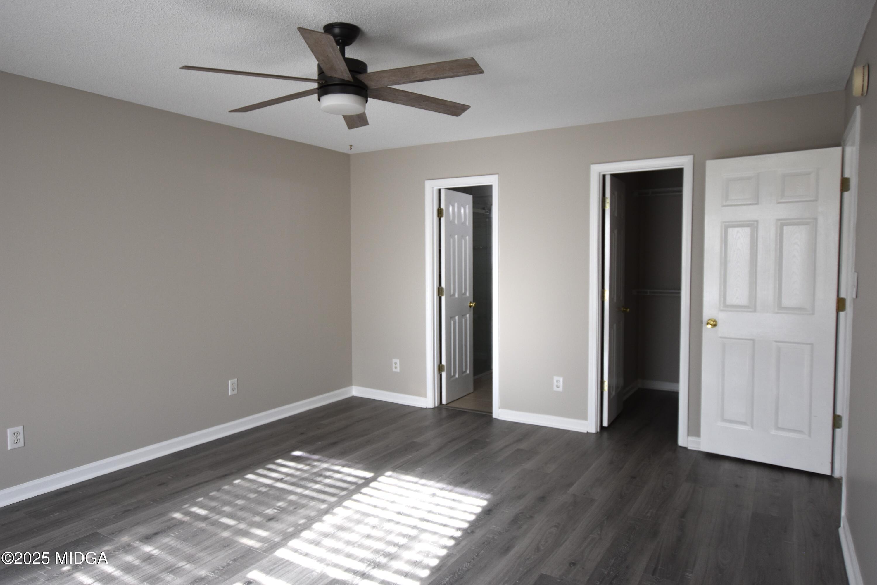 6550 Skipper Road Macon, GA 31216 - Photo 25 of 35 a view of an empty room and window and wooden floor