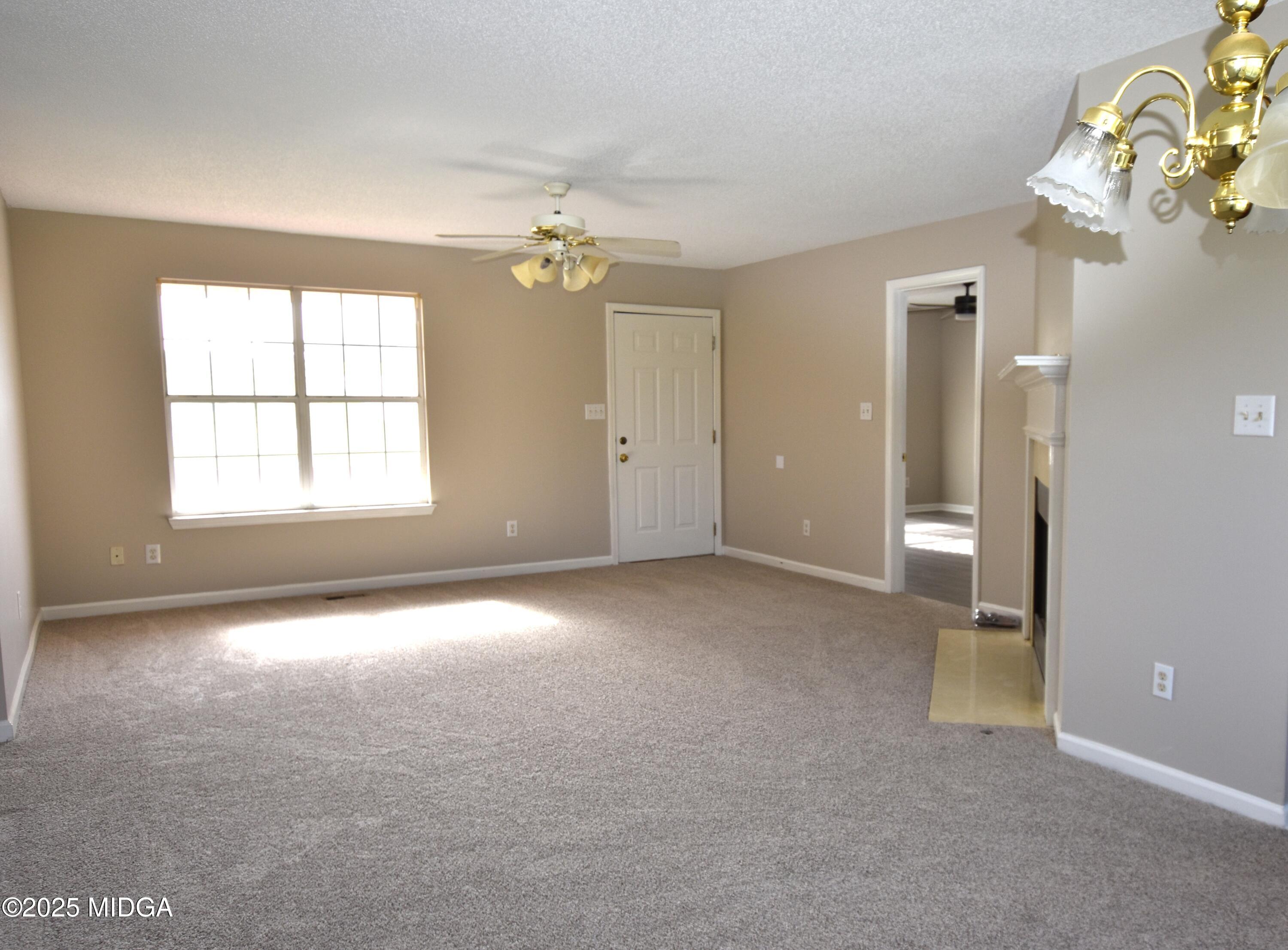 6550 Skipper Road Macon, GA 31216 - Photo 28 of 35 wooden floor and windows in an empty room
