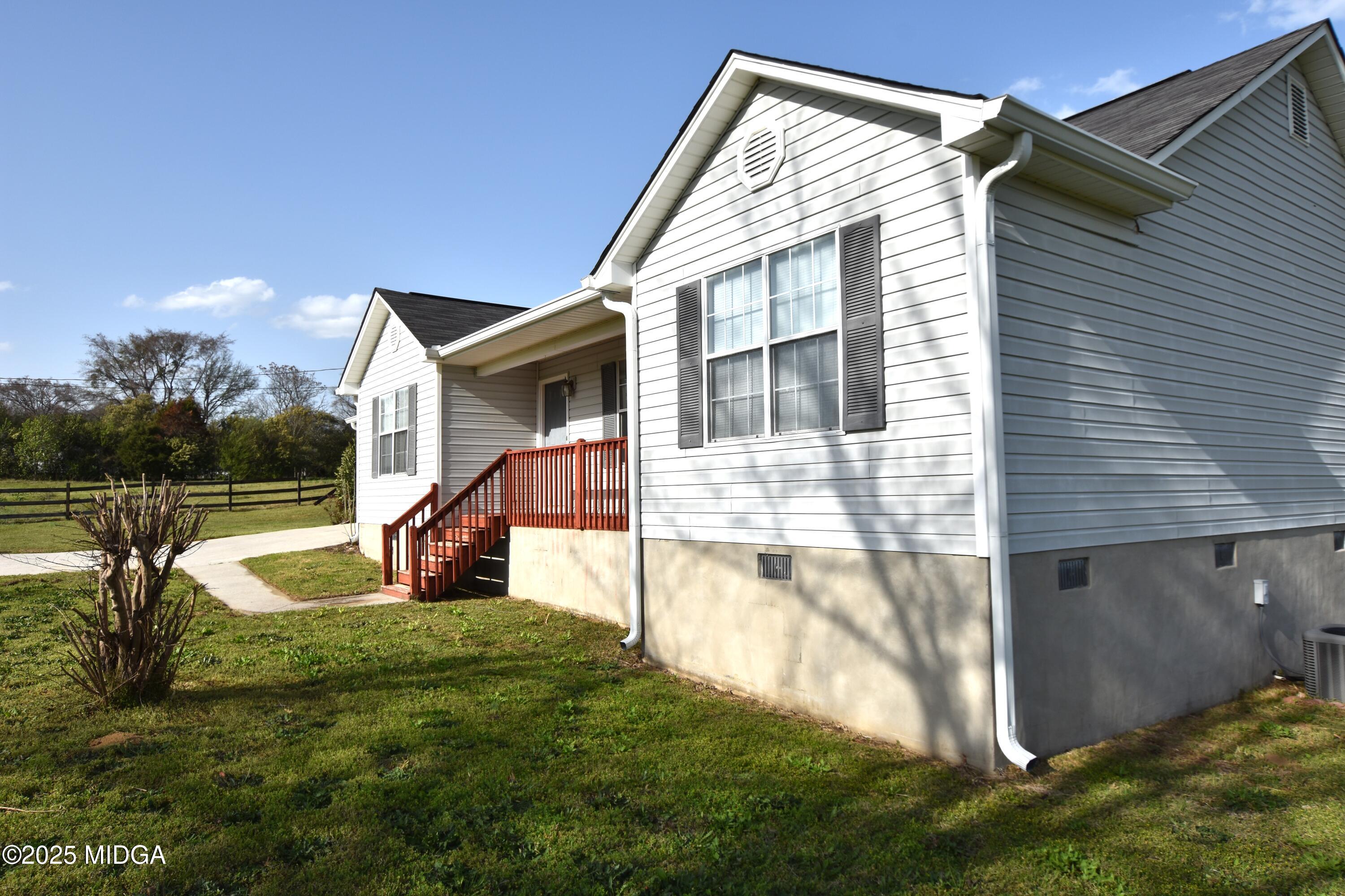 6550 Skipper Road Macon, GA 31216 - Photo 5 of 35 a view of a house with a yard