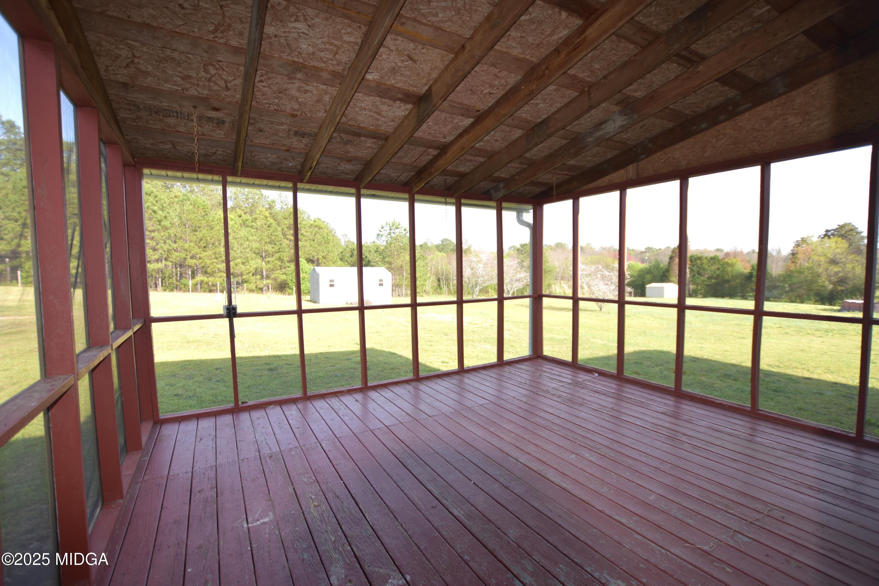 6550 Skipper Road Macon, GA 31216 - Photo 9 of 35 a view of empty room with wooden floor and floor to ceiling windows
