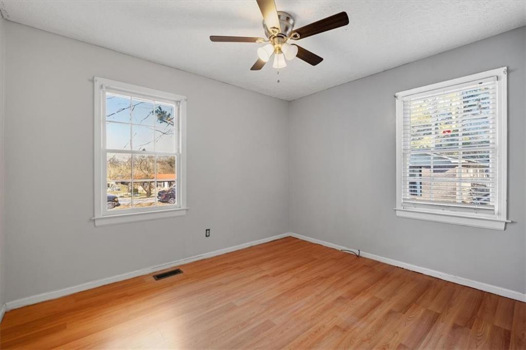 95 Cash Town Road Aragon, GA 30104 - Photo 13 of 22 a view of empty room with wooden floor and fan