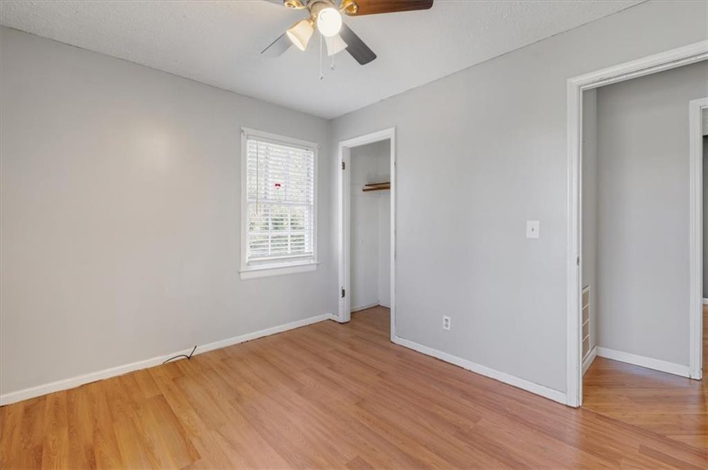 95 Cash Town Road Aragon, GA 30104 - Photo 14 of 22 wooden floor in an empty room with a window