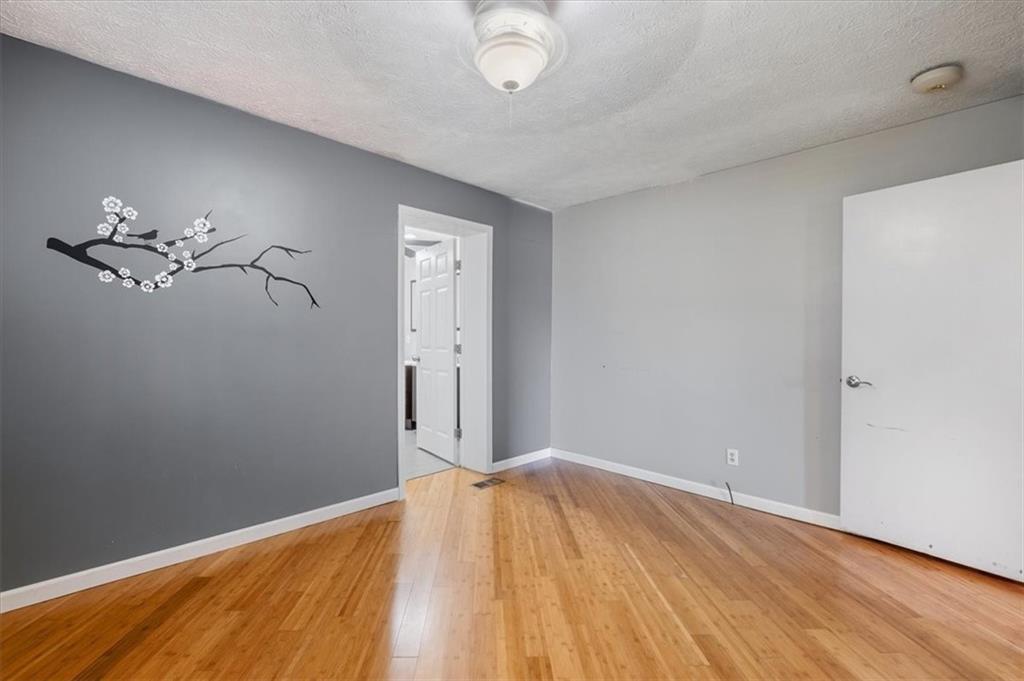95 Cash Town Road Aragon, GA 30104 - Photo 19 of 22 a view of a room with wooden floor and fan
