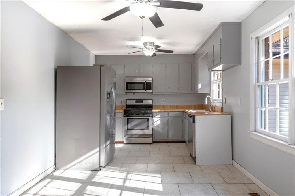 95 Cash Town Road Aragon, GA 30104 - Photo 4 of 22 a kitchen with a stove a refrigerator and a sink