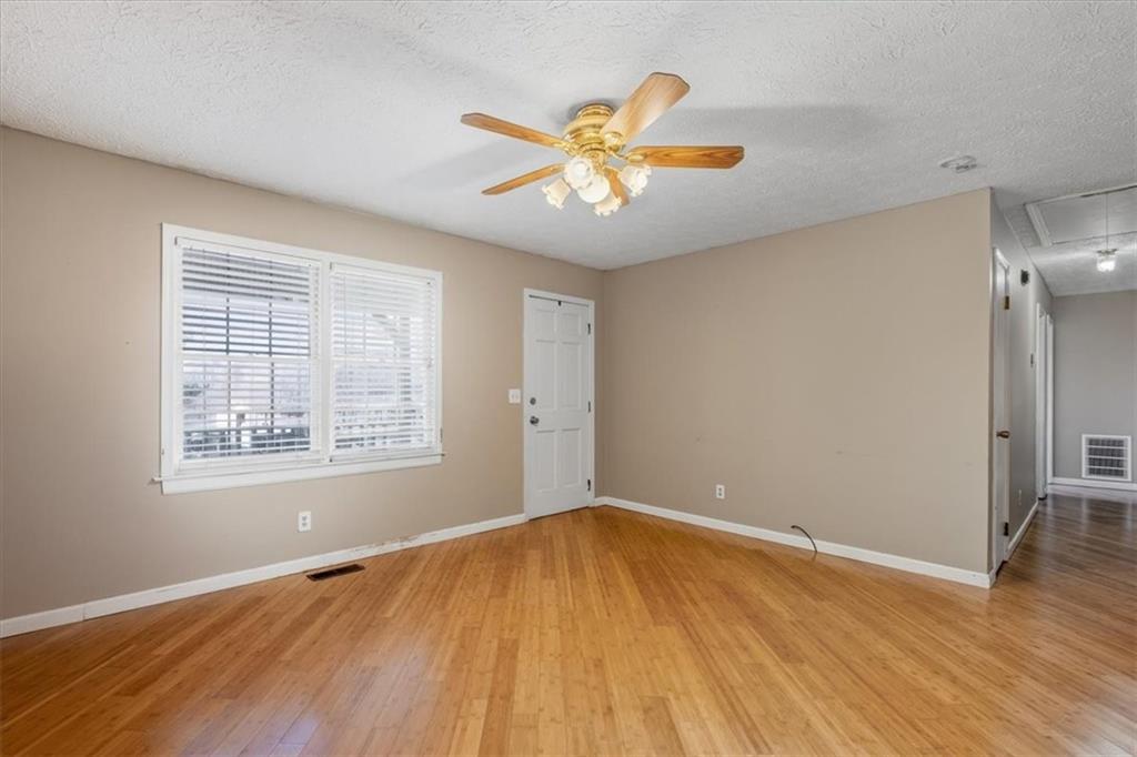 95 Cash Town Road Aragon, GA 30104 - Photo 9 of 22 a view of an empty room with wooden floor and a window