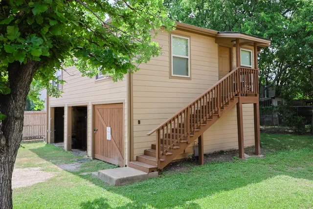 a view of a house with a yard and a yard