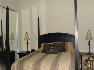 13 Napoleon Road Rancho Mirage, CA 92270 - Photo 14 of 23 a bedroom with a bed and a closet