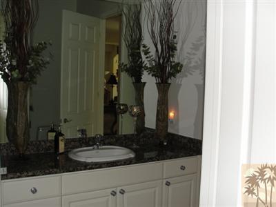 13 Napoleon Road Rancho Mirage, CA 92270 - Photo 15 of 23 a bathroom with a sink and a mirror