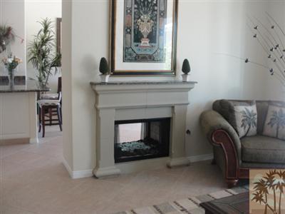 13 Napoleon Road Rancho Mirage, CA 92270 - Photo 6 of 23 a living room with furniture and a fireplace