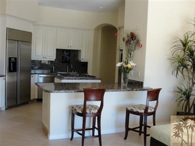 13 Napoleon Road Rancho Mirage, CA 92270 - Photo 8 of 23 a kitchen with a table and chairs in it