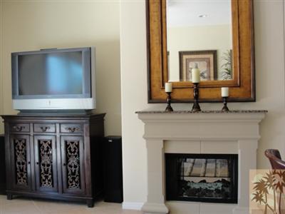 13 Napoleon Road Rancho Mirage, CA 92270 - Photo 9 of 23 a living room with fireplace and a wooden floor