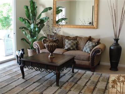 13 Napoleon Road Rancho Mirage, CA 92270 - Photo 10 of 23 a living room with furniture potted plant and wooden floor