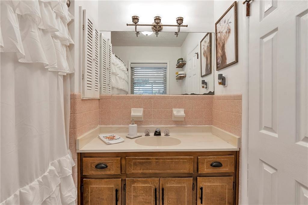 2037 Pinetree Trail Gainesville, GA 30501 - Photo 20 of 35 a bathroom with a sink and a mirror