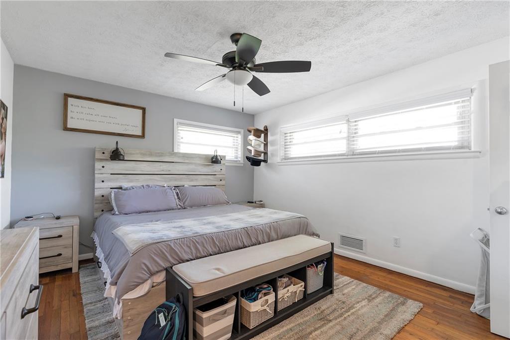 2037 Pinetree Trail Gainesville, GA 30501 - Photo 25 of 35 a bedroom with a bed and a large mirror