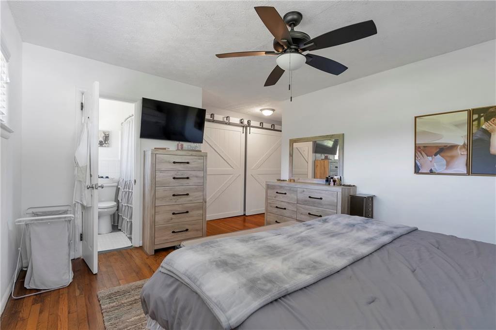 2037 Pinetree Trail Gainesville, GA 30501 - Photo 27 of 35 a bed room with a bed and a television