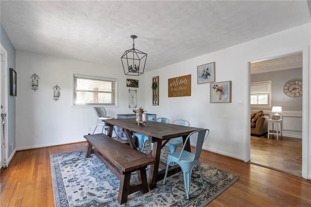2037 Pinetree Trail Gainesville, GA 30501 - Photo 10 of 35 a view of a dining room with furniture and wooden floor