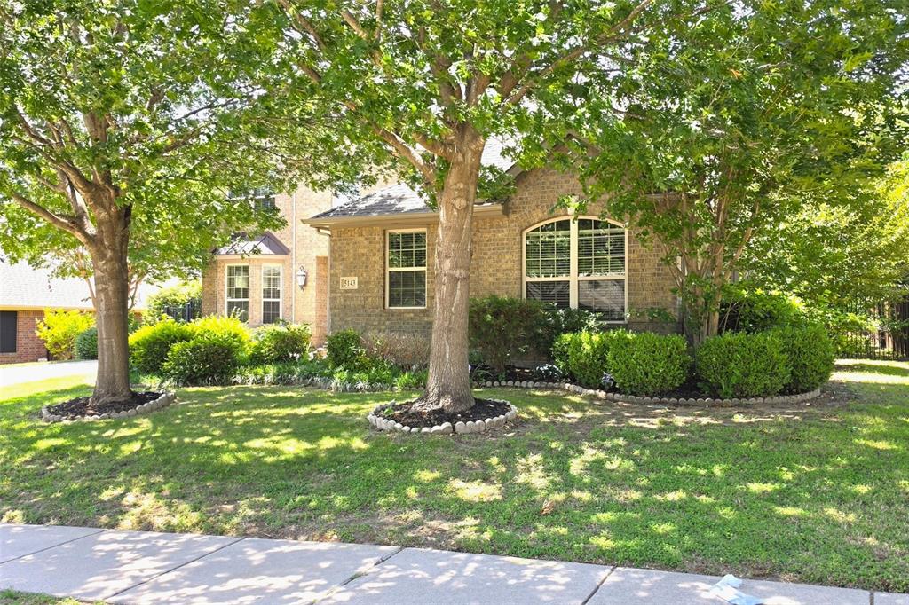 5143 Stream Crest Way Fairview, TX 75069 - Photo 3 of 35 Brick exterior home with arched window and established landscaping
