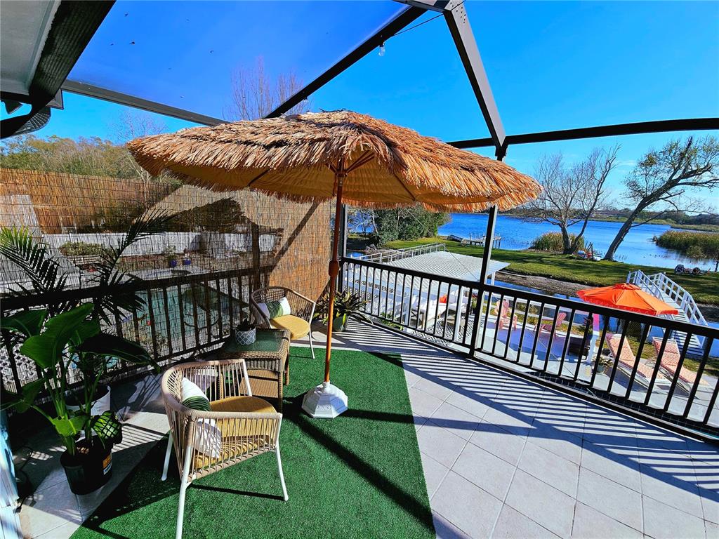 2153 Karan Way Clearwater, FL 33763 - Photo 44 of 65 a view of a chair and table in the patio