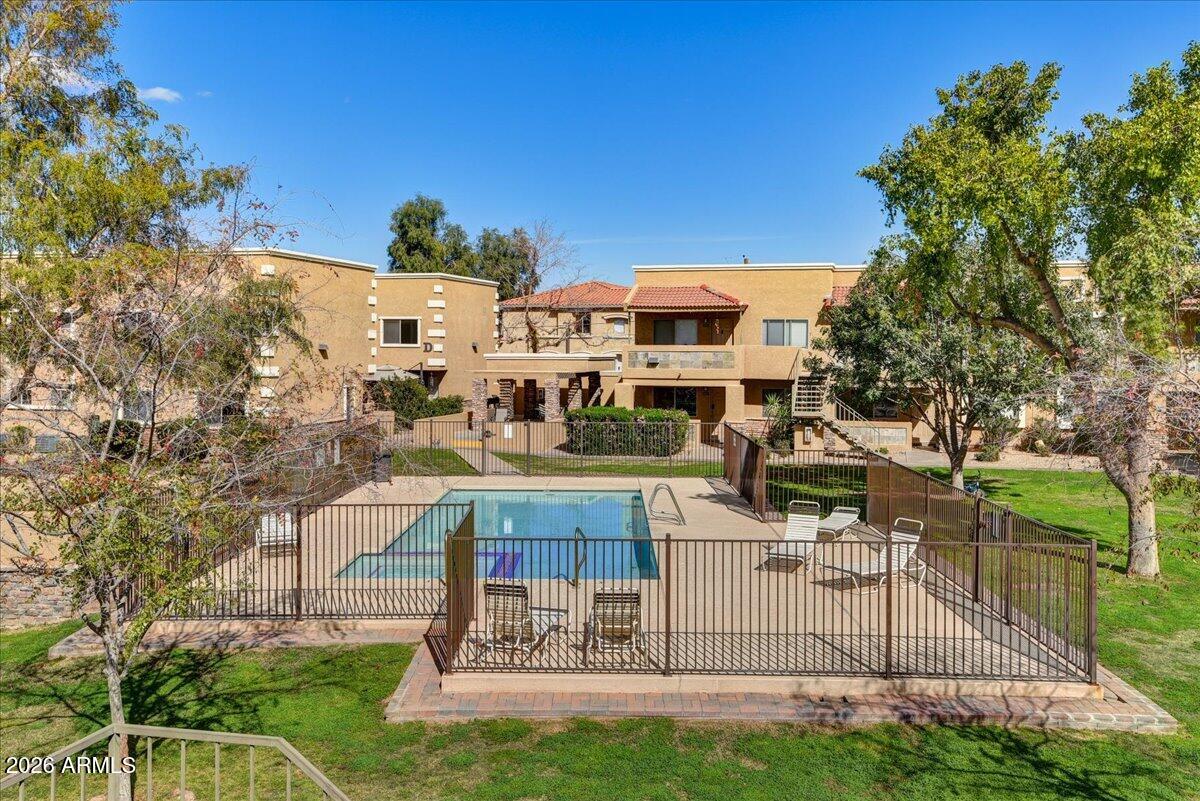 303 North Miller Road, Unit 2002 Scottsdale, AZ 85257 - Photo 12 of 12 a view of a building with a yard