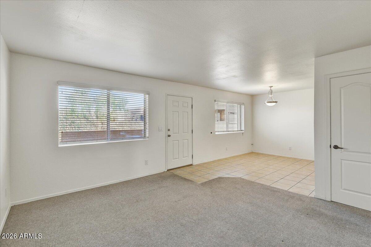 303 North Miller Road, Unit 2002 Scottsdale, AZ 85257 - Photo 3 of 12 an empty room with windows