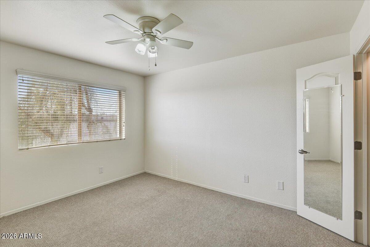 303 North Miller Road, Unit 2002 Scottsdale, AZ 85257 - Photo 8 of 12 a view of an empty room with a window