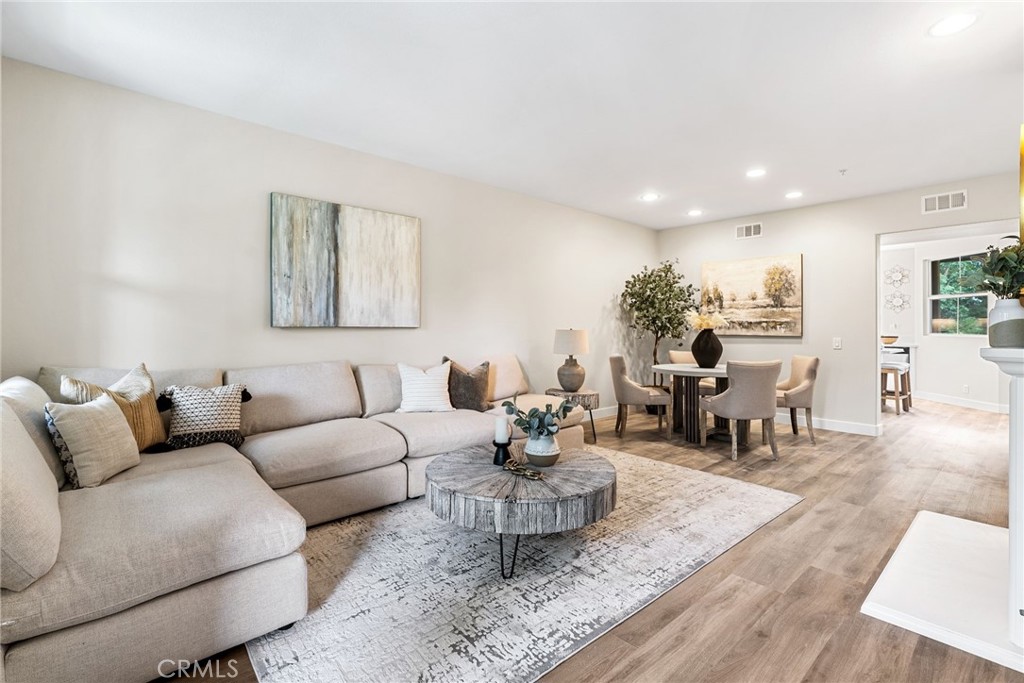 61 Stepping Stone Irvine, CA 92603 - Photo 1 of 24 a living room with furniture and wooden floor