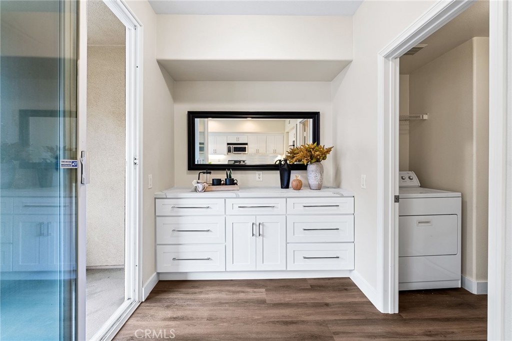 61 Stepping Stone Irvine, CA 92603 - Photo 12 of 24 a bathroom with a vanity a mirror and a sink
