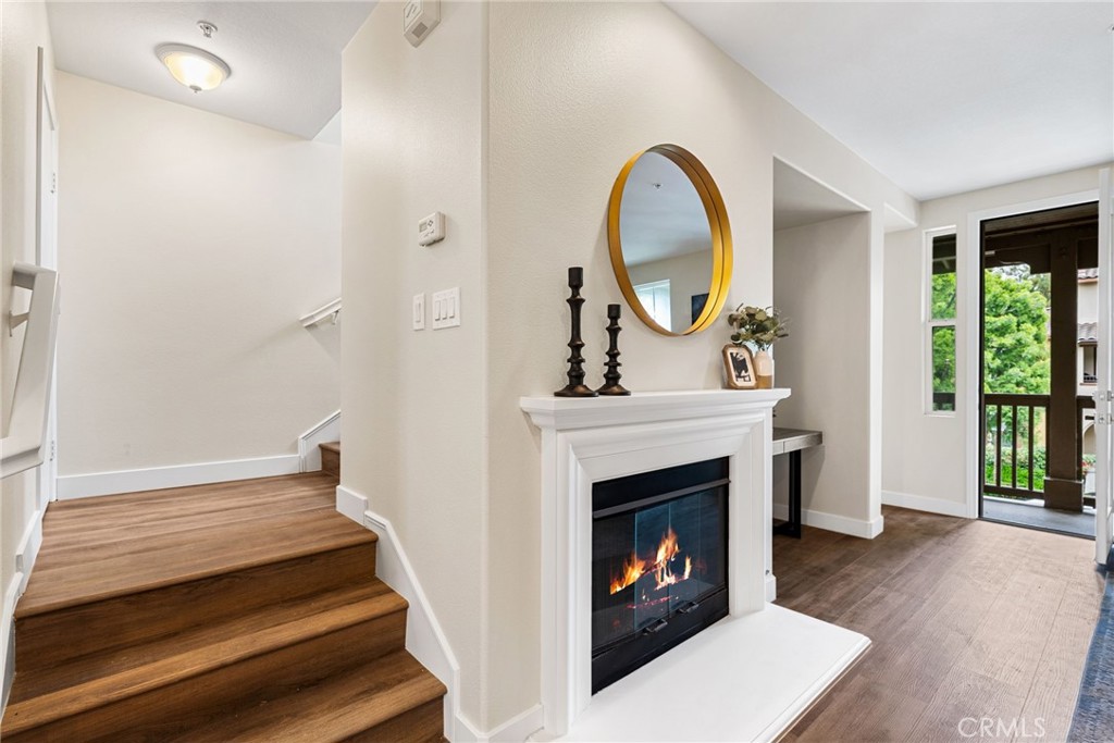 61 Stepping Stone Irvine, CA 92603 - Photo 19 of 24 a living room with furniture and a fireplace