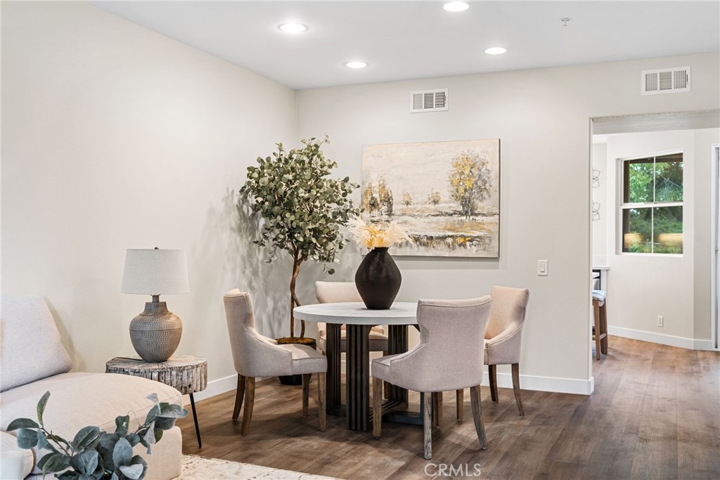 61 Stepping Stone Irvine, CA 92603 - Photo 5 of 24 a view of a dining room with furniture and wooden floor
