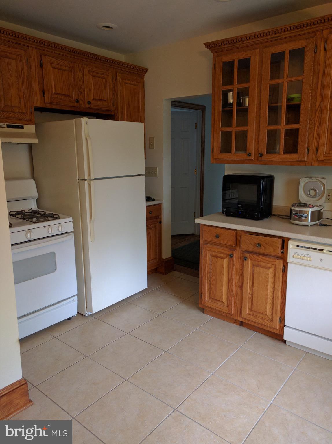 101 South Princeton Avenue, Unit 2B Swarthmore, PA 19081 - Photo 5 of 11 a kitchen with stainless steel appliances granite countertop a stove a refrigerator and a cabinets