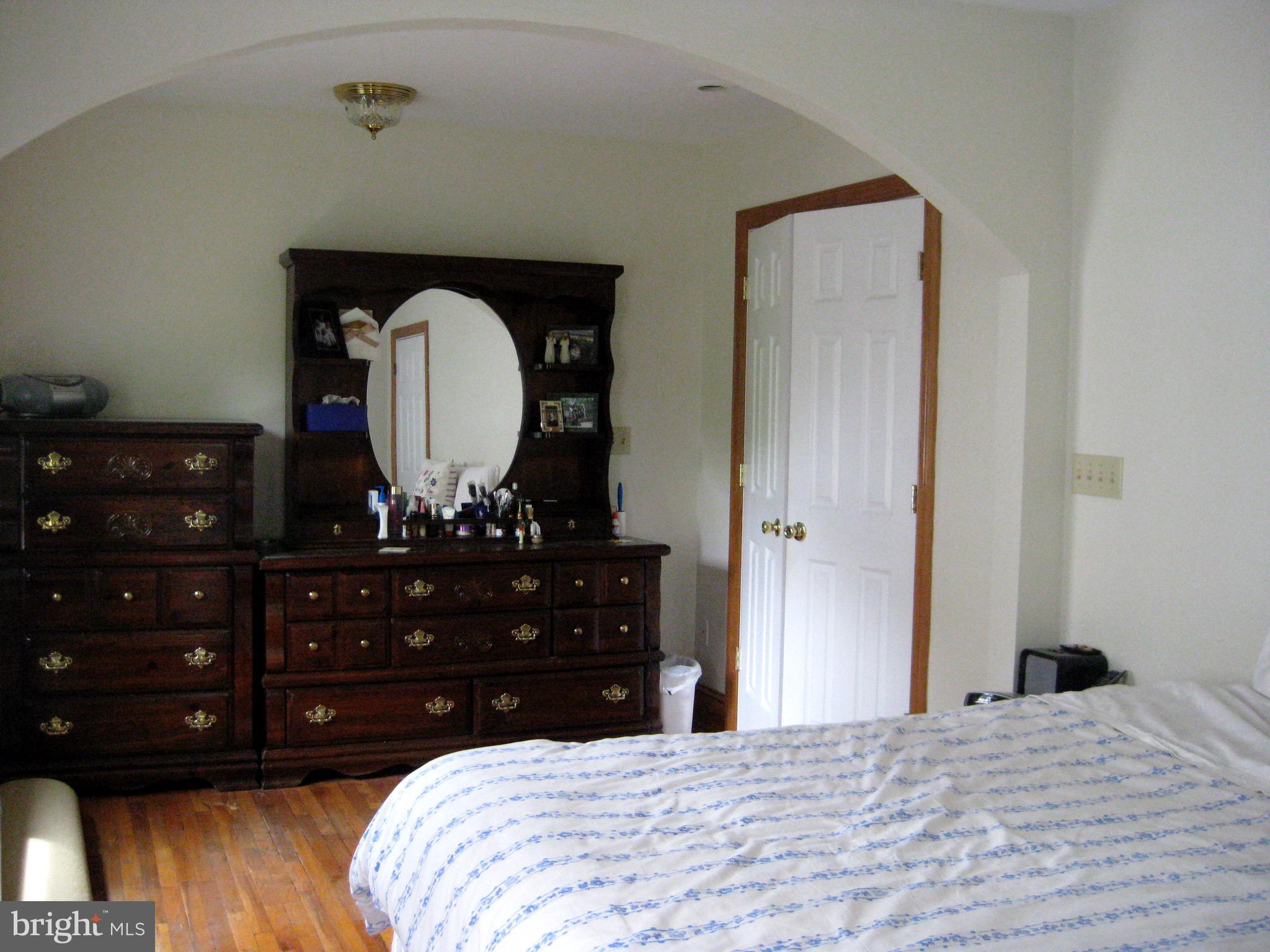 101 South Princeton Avenue, Unit 2B Swarthmore, PA 19081 - Photo 7 of 11 a bedroom with a bed and a dresser