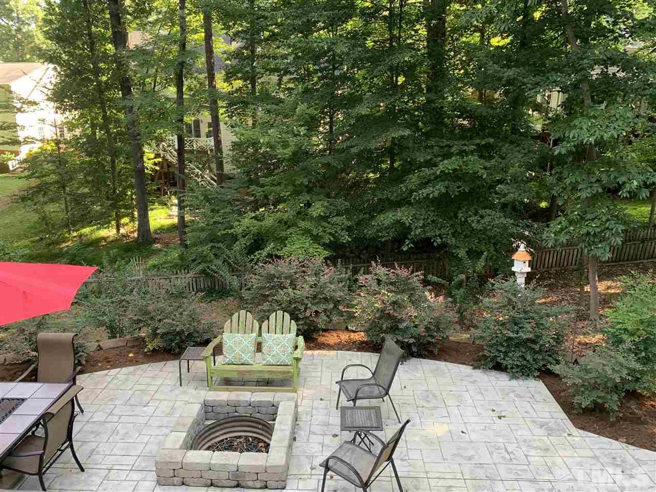7907 Sandy Bottom Way Raleigh, NC 27613 - Photo 16 of 20 Firepit & huge stamped concrete patio!