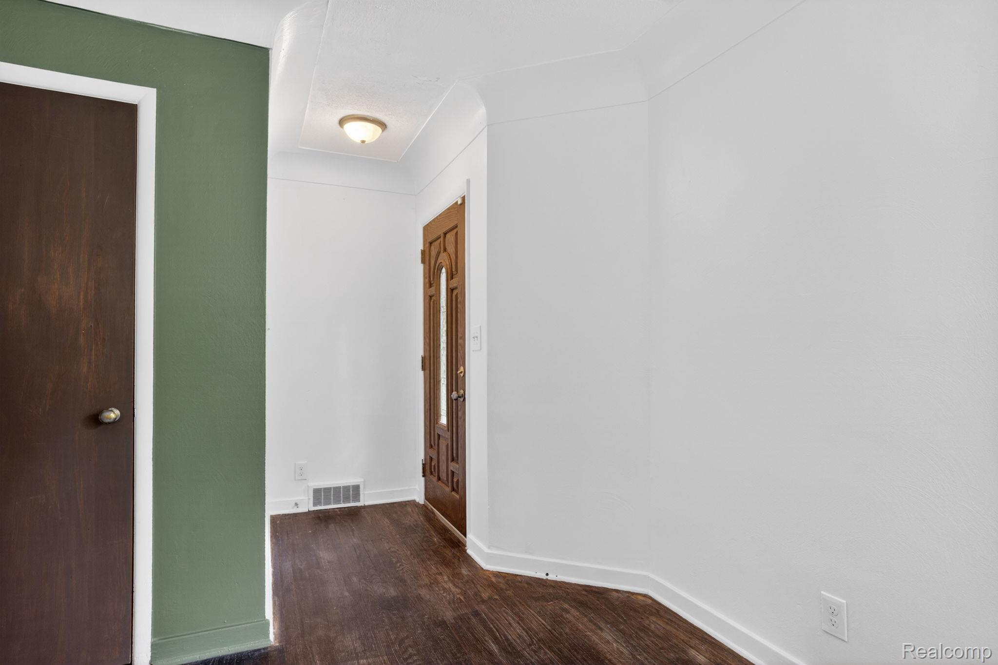 1209 Beatrice Street Flushing, MI 48433 - Photo 17 of 39 Corridor with dark wood-style floors and baseboards
