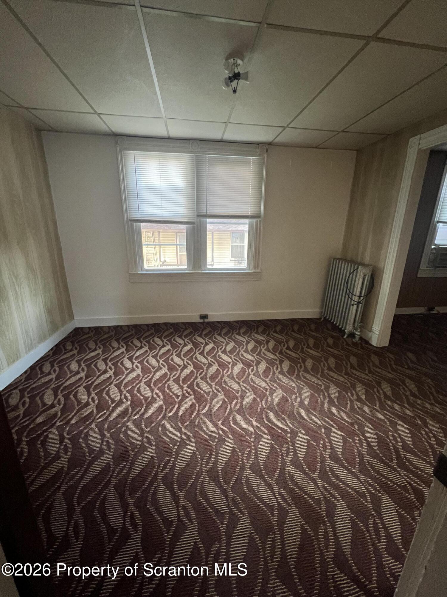 812 Butler Street Dunmore, PA 18512 - Photo 9 of 15 a view of an empty room with a window