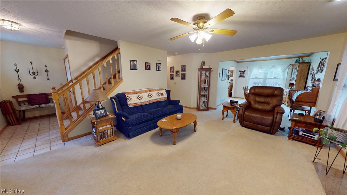 12431 Carter Road Painesville, OH 44077 - Photo 3 of 33 Tiled living room with ceiling fan