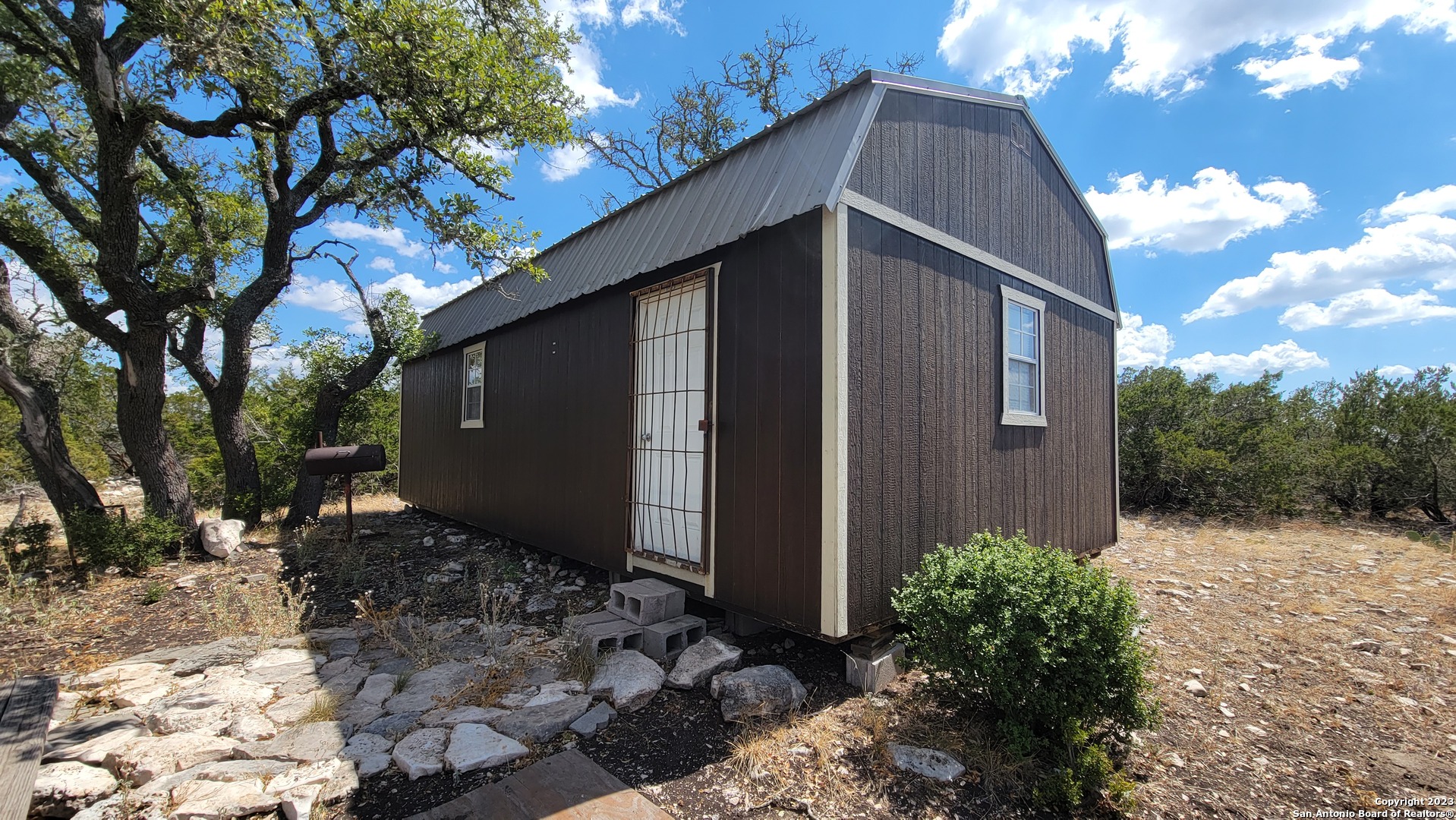 a backyard of a house with lots of green space