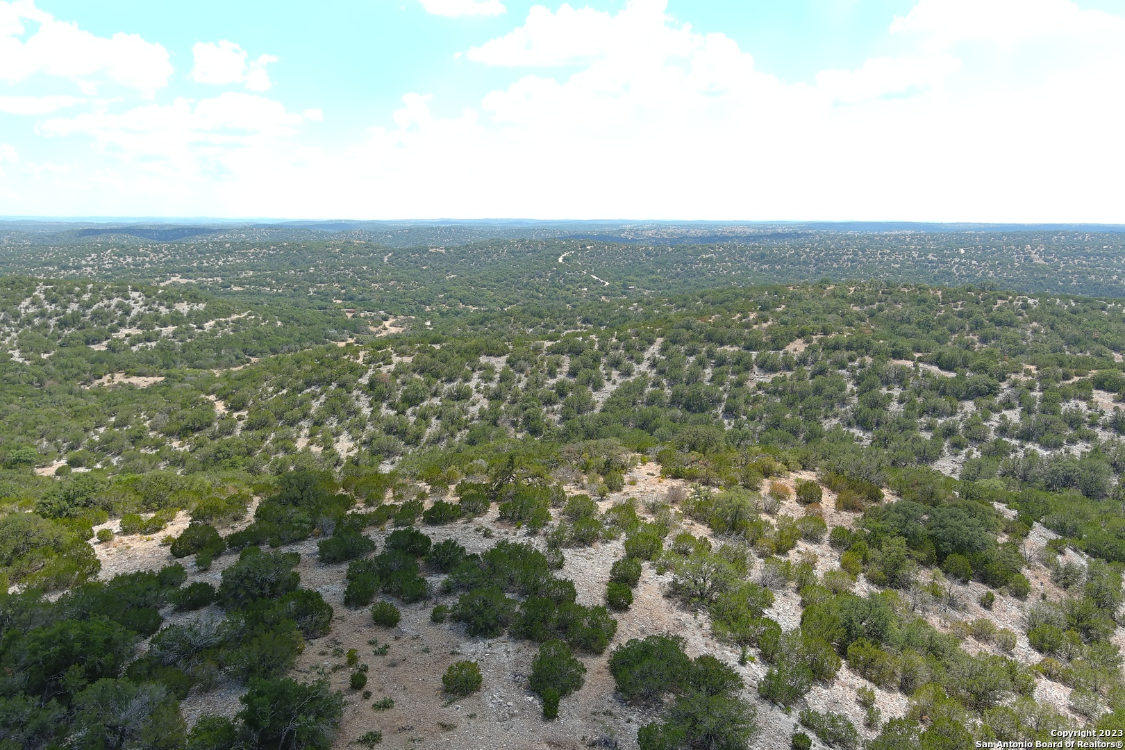 0 Stagecoach Rocksprings, TX 78880 - Photo 20 of 24 an aerial view of house with yard and mountain view in back
