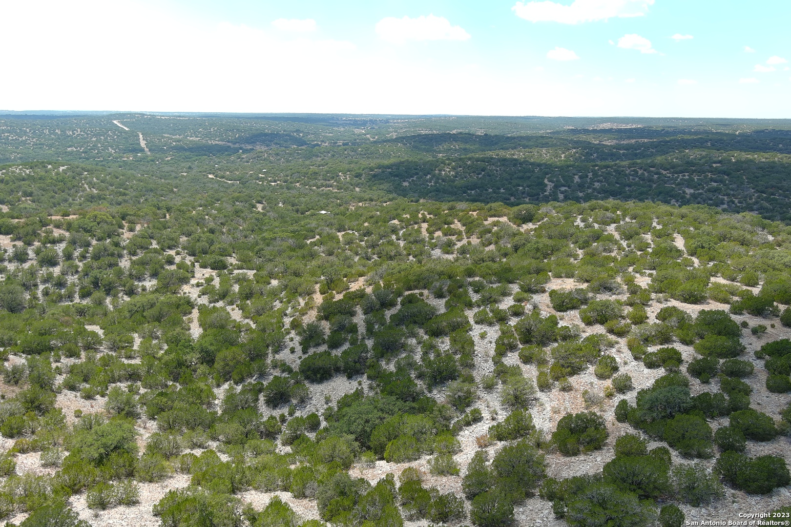 0 Stagecoach Rocksprings, TX 78880 - Photo 22 of 24 a view of a city with lush green forest
