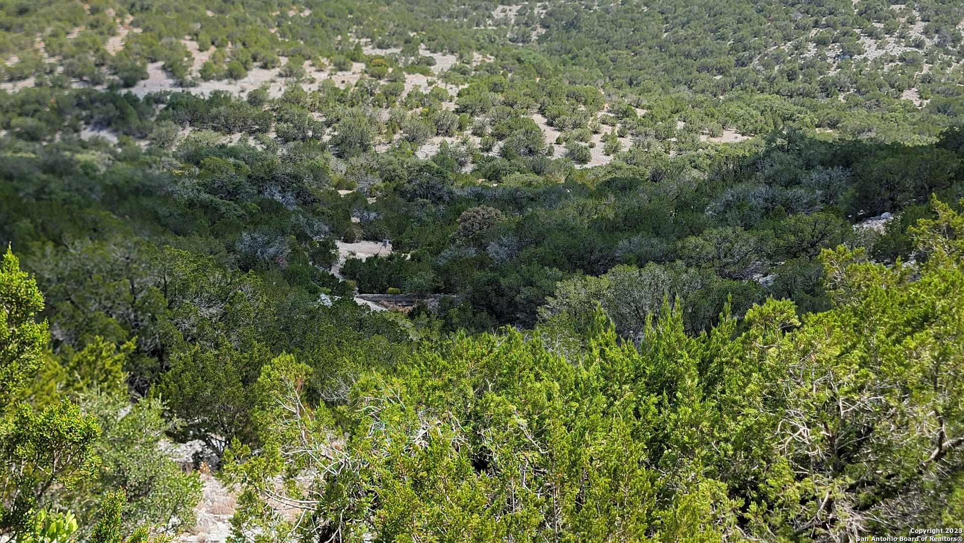 0 Stagecoach Rocksprings, TX 78880 - Photo 6 of 24 an aerial view of residential house with outdoor space and trees all around